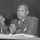 Singer Paul Robeson testifies in Washington, D.C., on June 12, 1956, before the House Committee on Un-American Activities. After a furious shouting session between the singer and Chairman Walter (D-Pa.) and other committee members, the group voted to cite Robeson for contempt. Later, Robeson told a reporter, “There was no contempt—I was just standing my ground.” (Bill Achatz/AP Images)